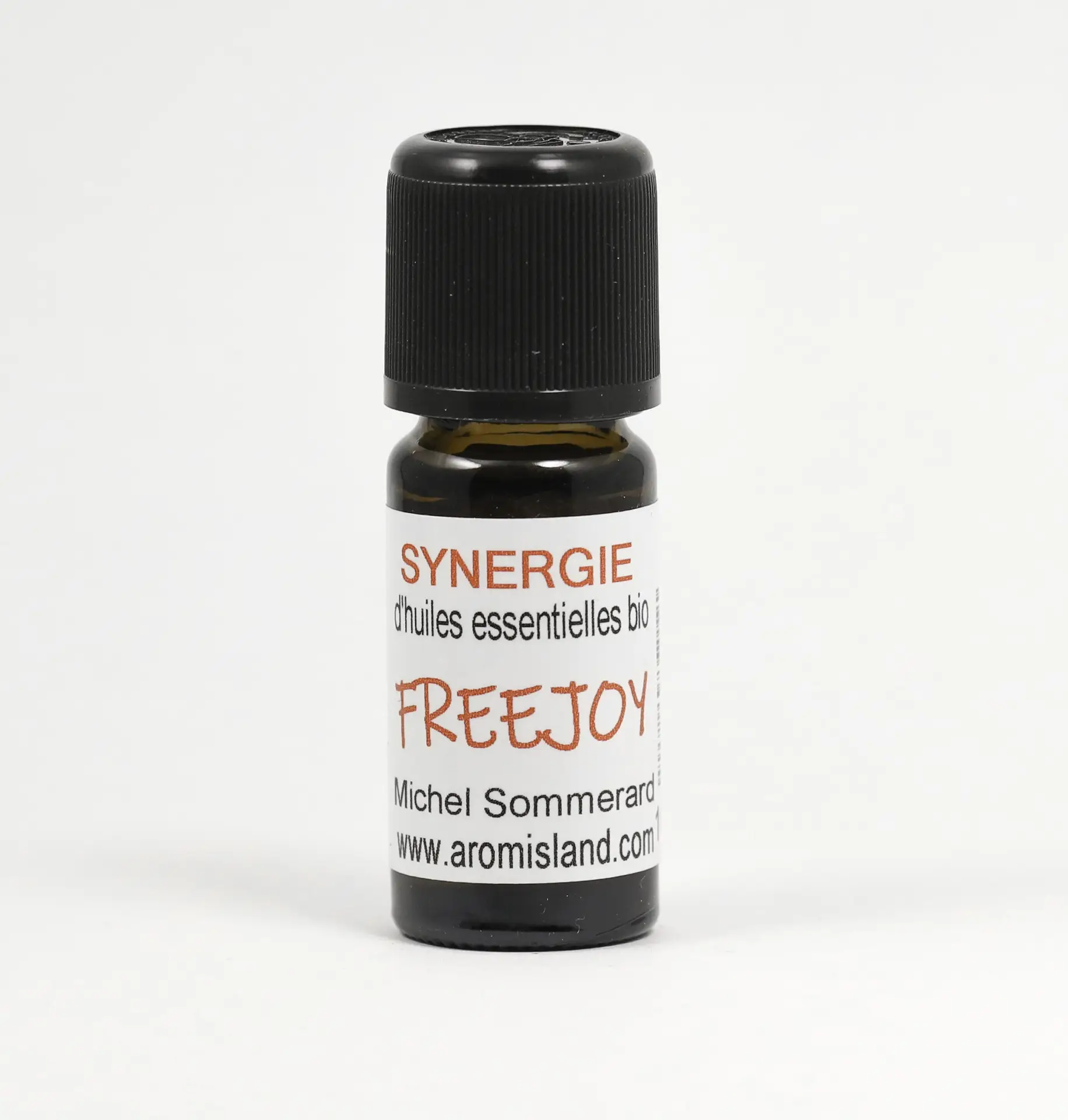 Flacon de Synergie Freejoy Plaisir et Liberté, mélange d’huiles essentielles bio aux notes pétillantes et sensuelles.